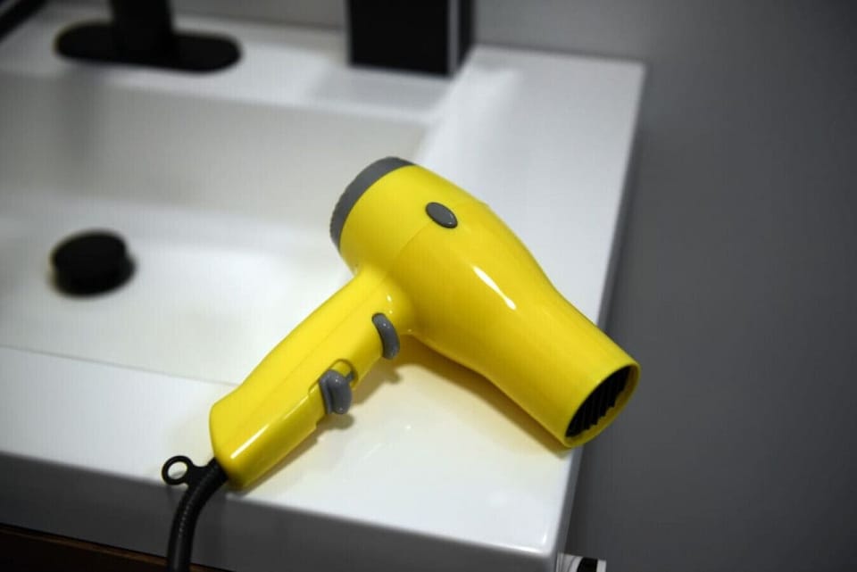 Complimentary hair dryer and premium bath essentials provided