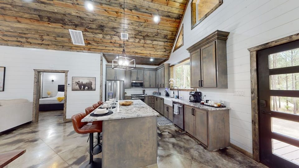 The fully stocked kitchen with gas range makes preparing meals easy and enjoyable.