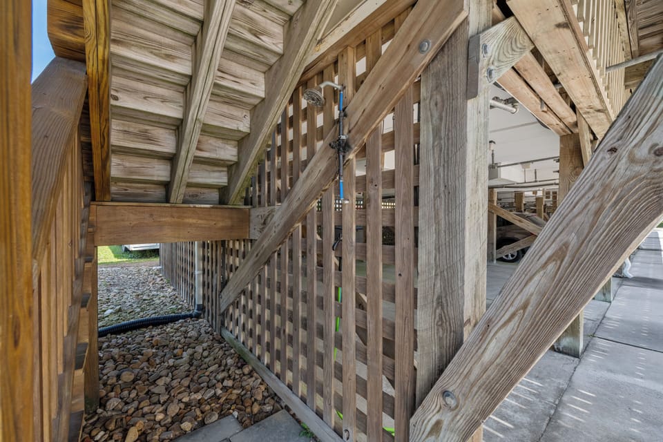 Rinse away the sand in the outdoor shower.