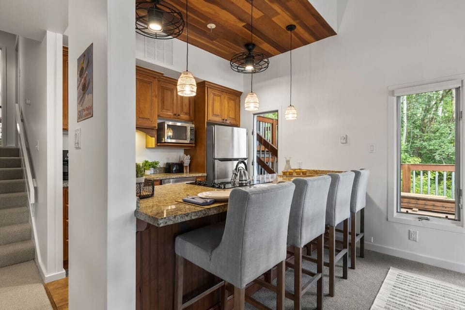 Entertain effortlessly in this open-concept kitchen with seating for four at the bar