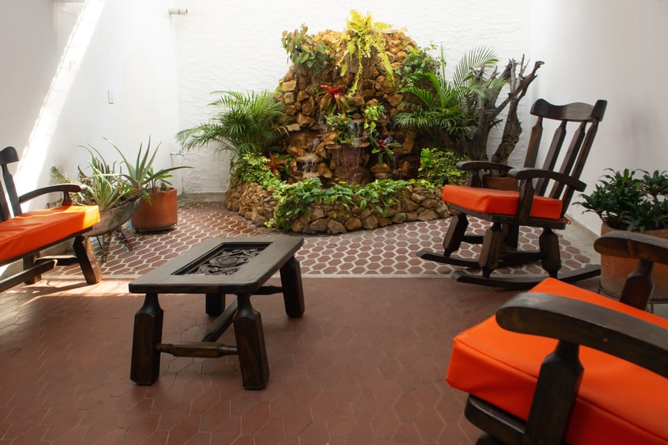 ZEN-LIKE PATIO AREA WITH PEACEFUL WATERFALL, HD/SMART TV, AND BLUETOOTH SPEAKERS