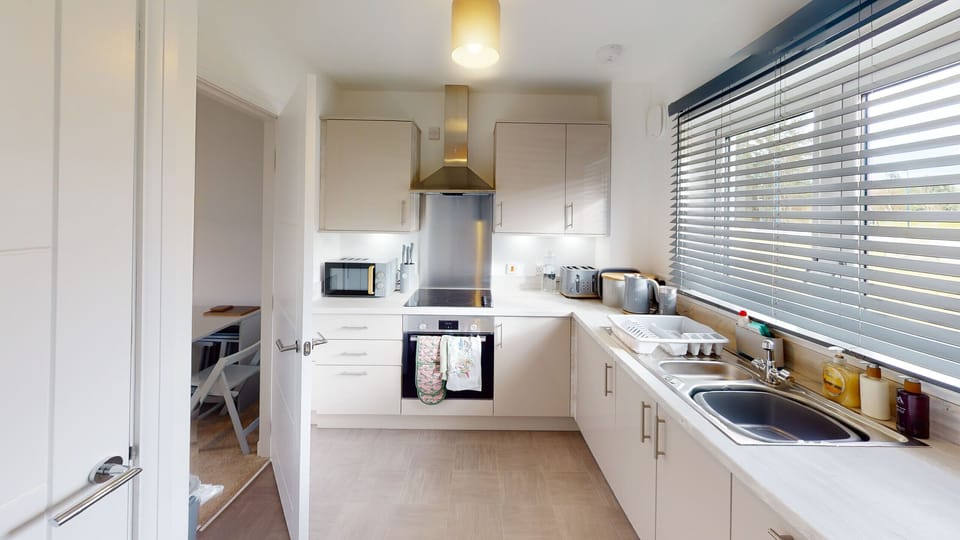 Modern kitchen with electric oven and hob
