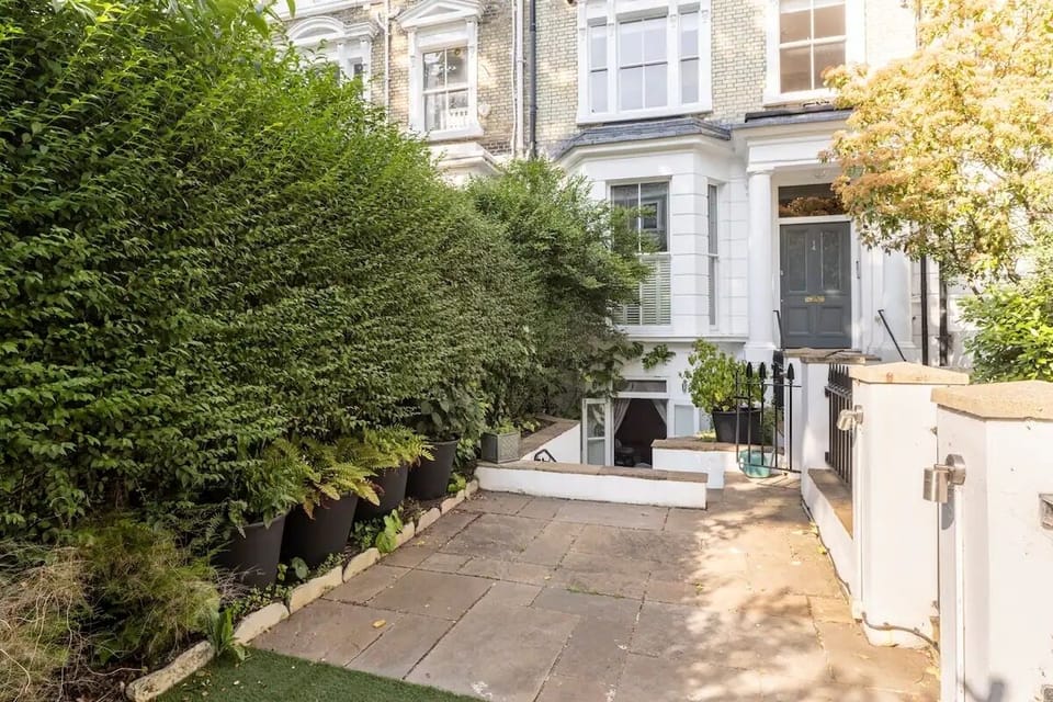 View from garden towards entrance down flight of steps