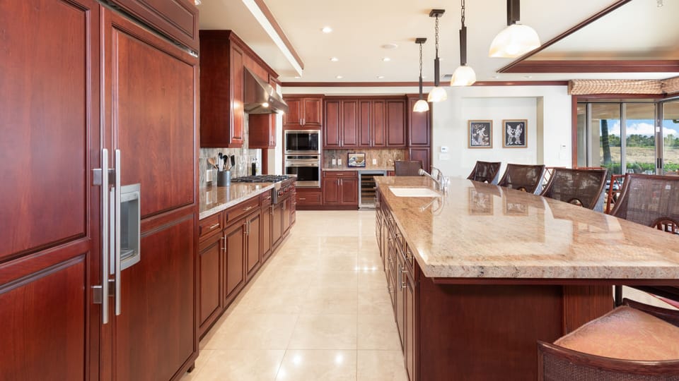 Gourmet kitchen with high end appliances and gas cooktop.