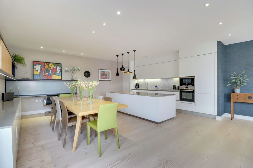Kitchen fitted with Smeg coffee maker, kettle and toaster; All-Clad cookware