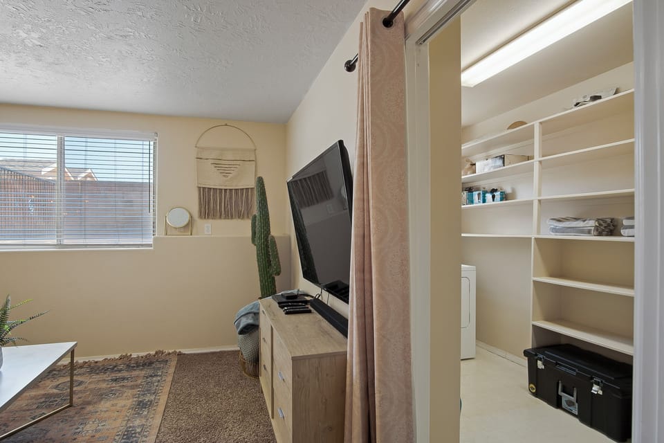 Television and entrance to laundry room