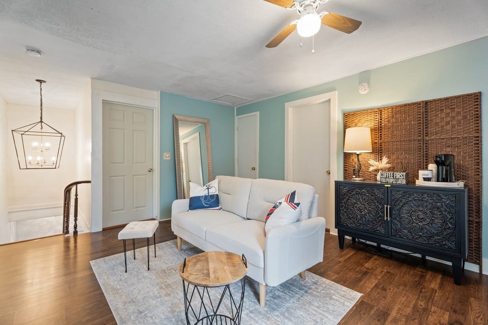 Three bedrooms and a second full bathroom can be accessed from here. 