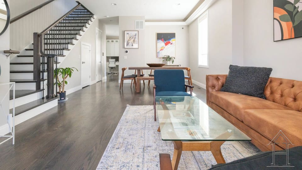Lux living and dining area at front of the home. Bright with high ceilings.