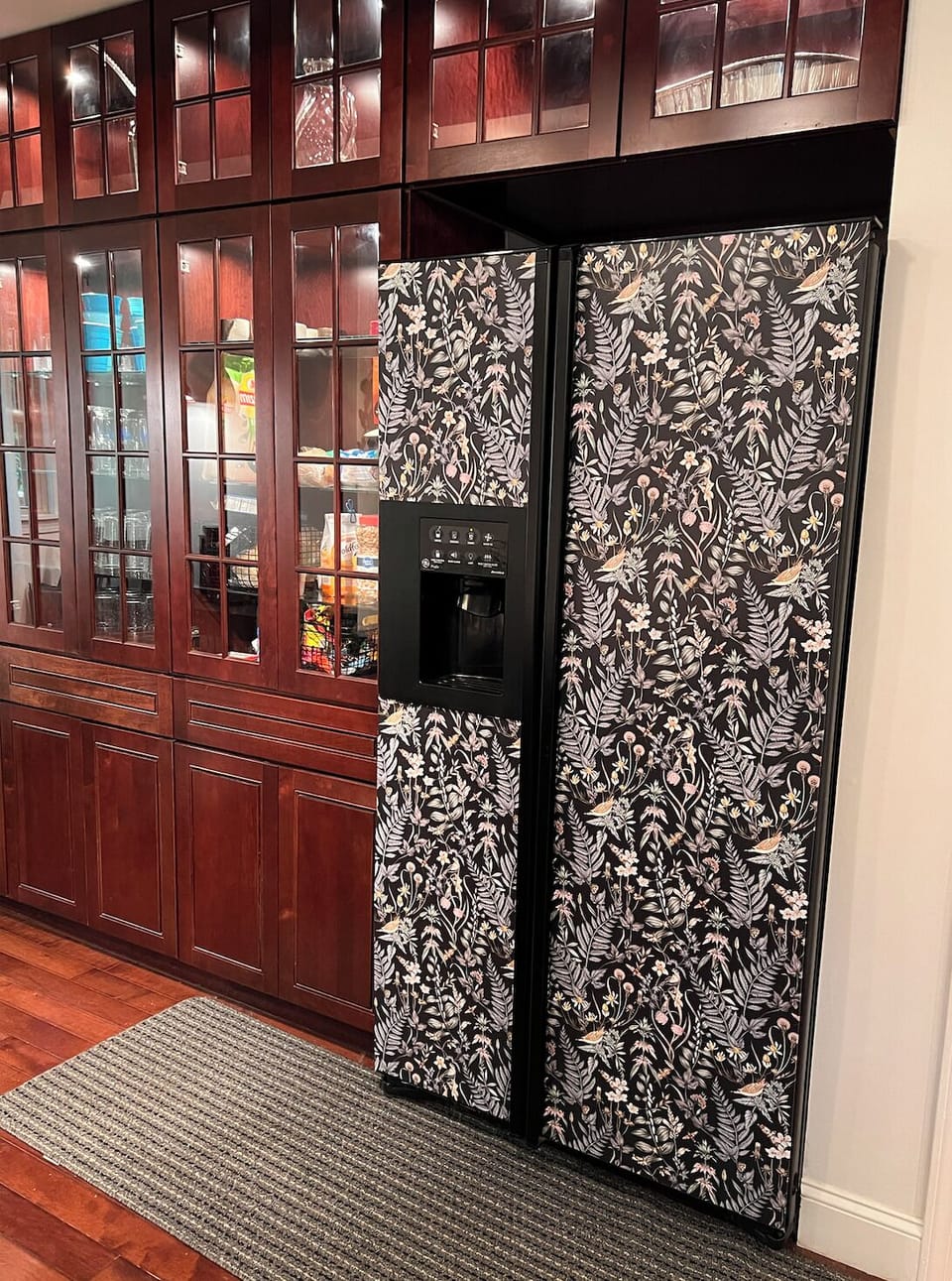 Kitchen with full-sized refrigerator. 