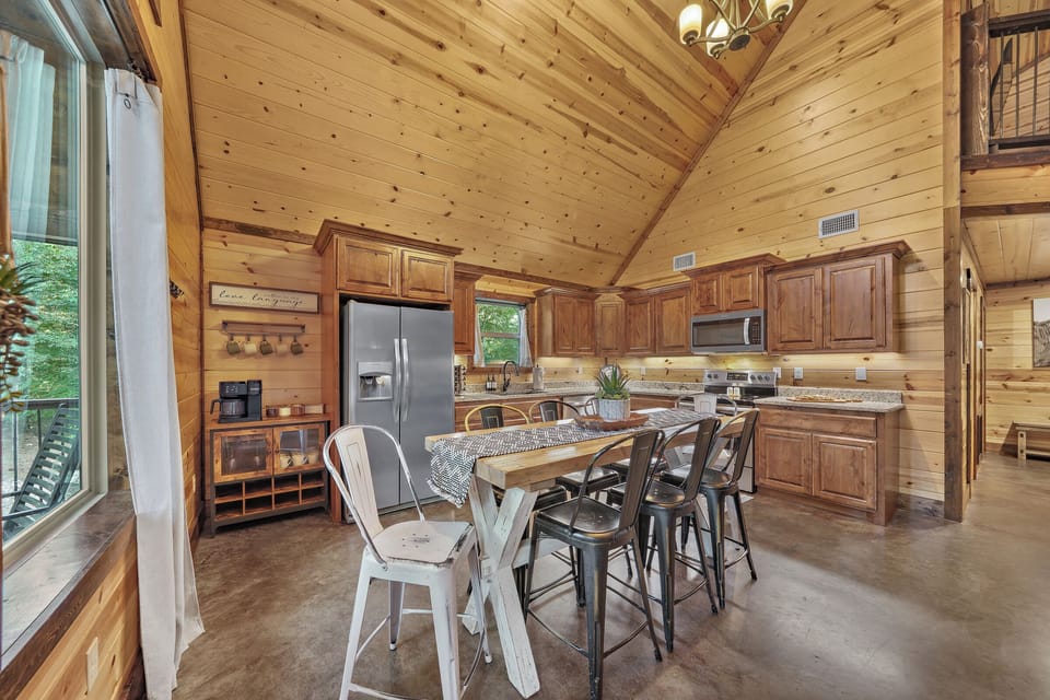 The spacious open plan kitchen lets you prepare meals while engaged in friendly conversation with your group.