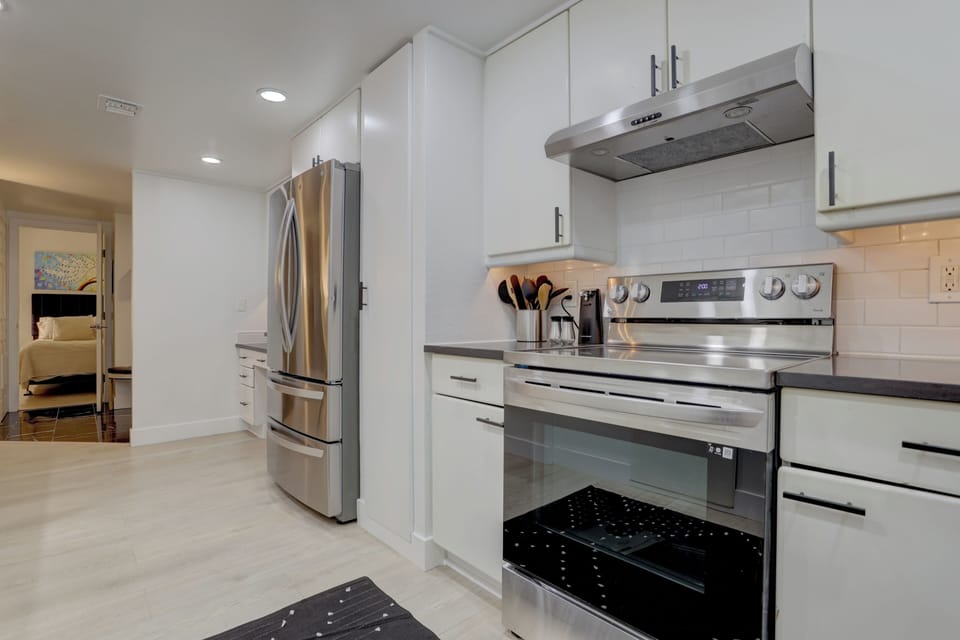 Kitchen entrance and queen bedroom view