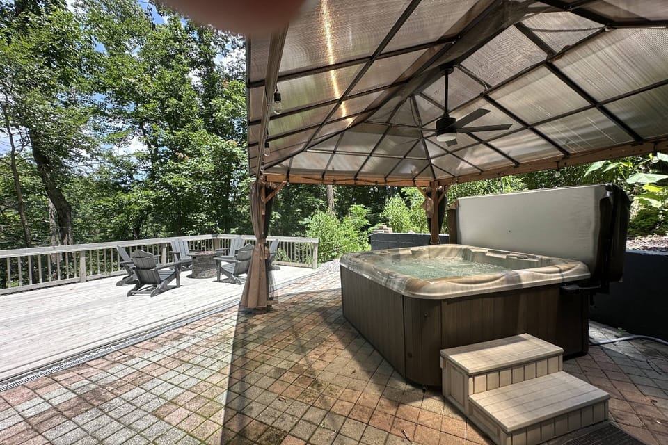 Covered hot tub and large deck overlooking the pond on 2-acres