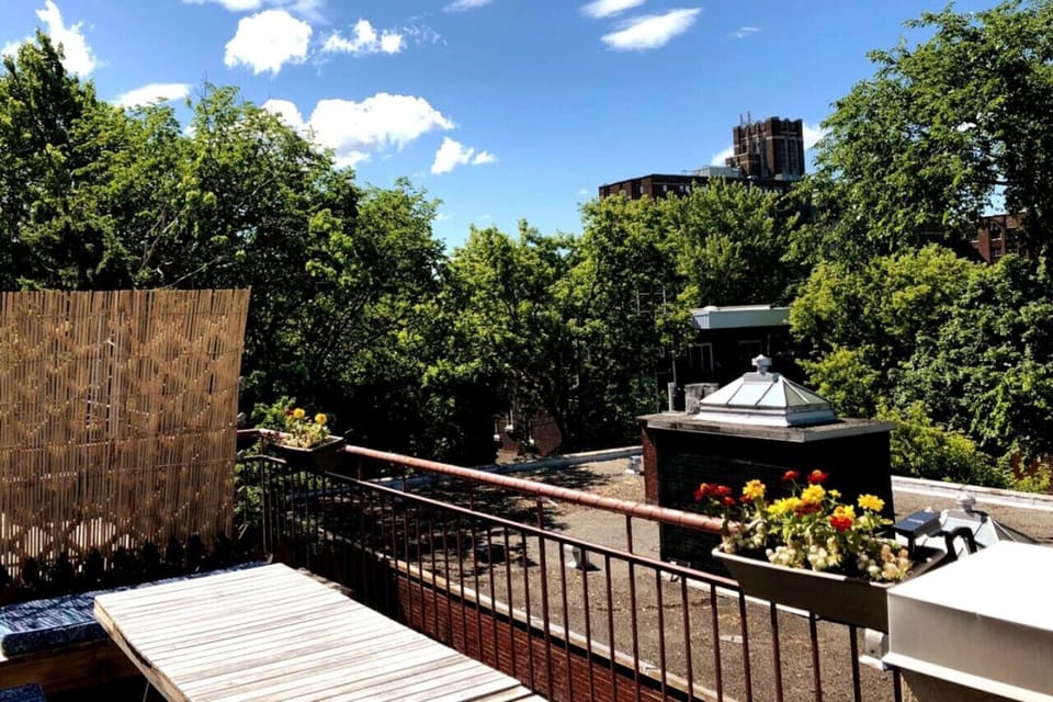Spacious balcony surrounded by trees—perfect for enjoying peaceful moments in nature.