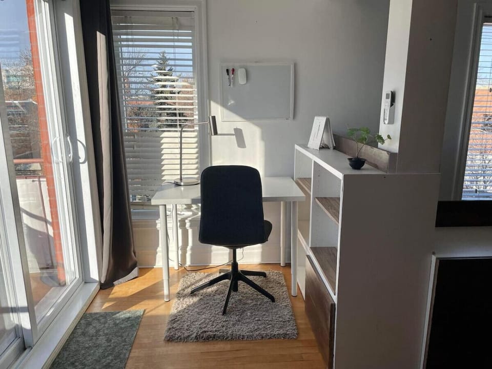 Bright work area adjacent to the balcony—combining natural light with inspiring outdoor views.