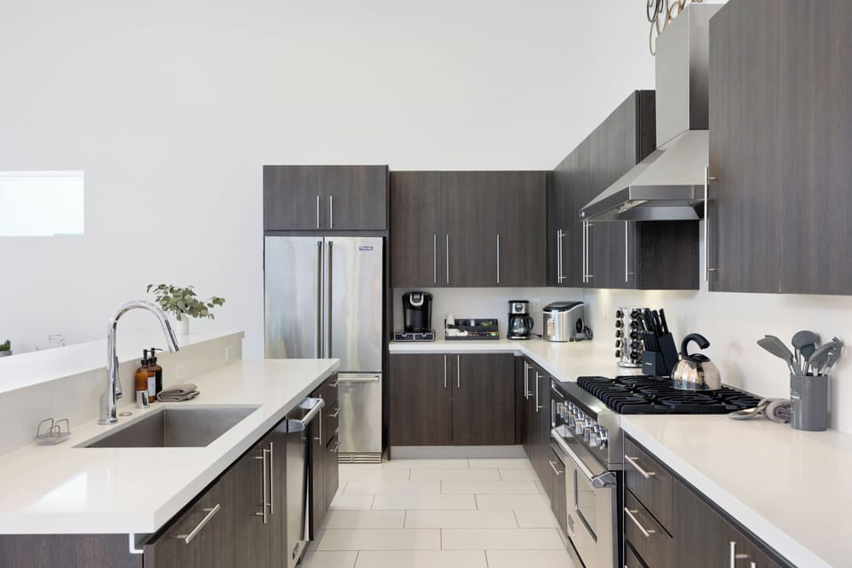 Modern appliances in the chef's kitchen, including a gas range.