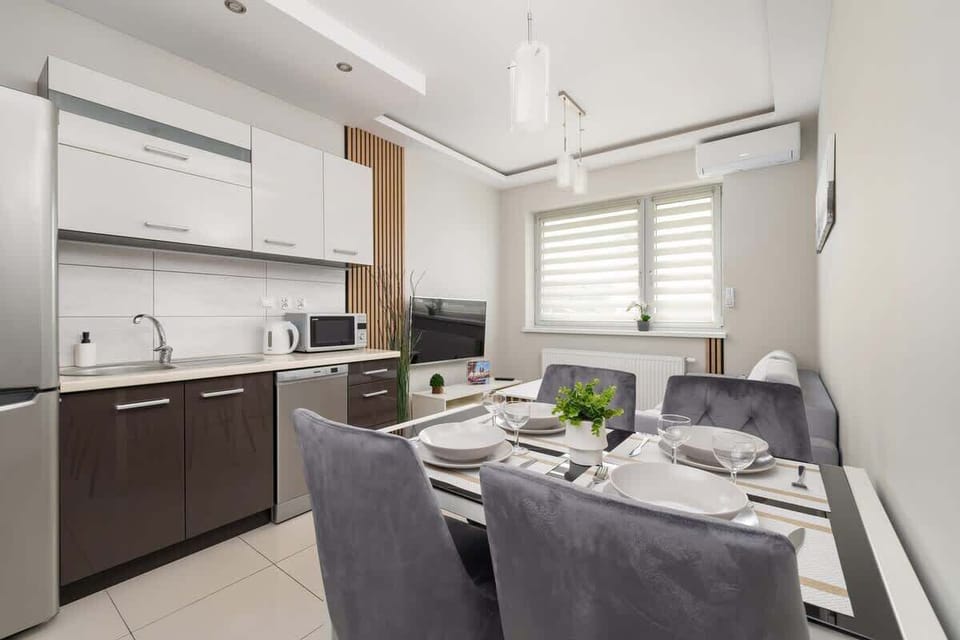 Another angle of the kitchen and dining space, showcasing functionality and style.

