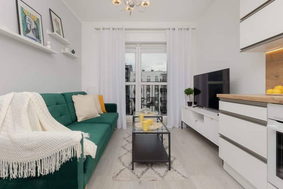 A wide-angle view of the living and dining area, emphasizing a functional and stylish interior.

