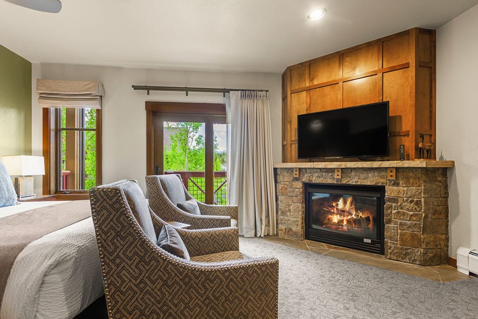 cozy chairs in front of gas fireplace