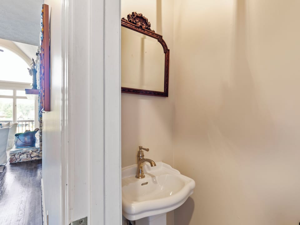 Main level powder room in hallway.