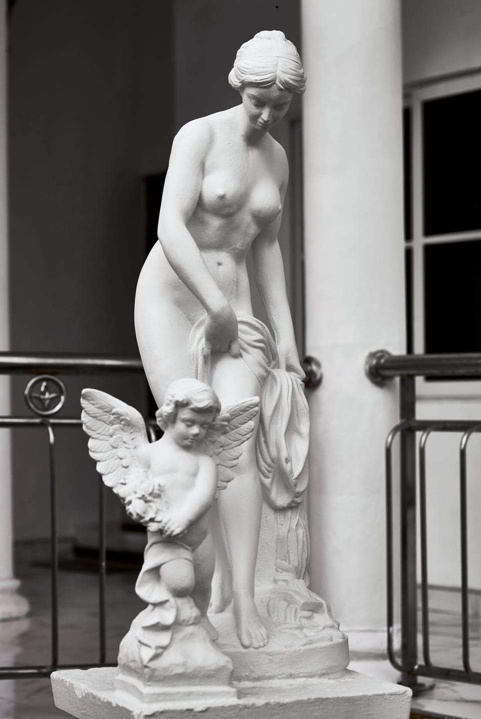 Impressive limestone statues of Venus & Cupid after bathing: Peacock Mansion.