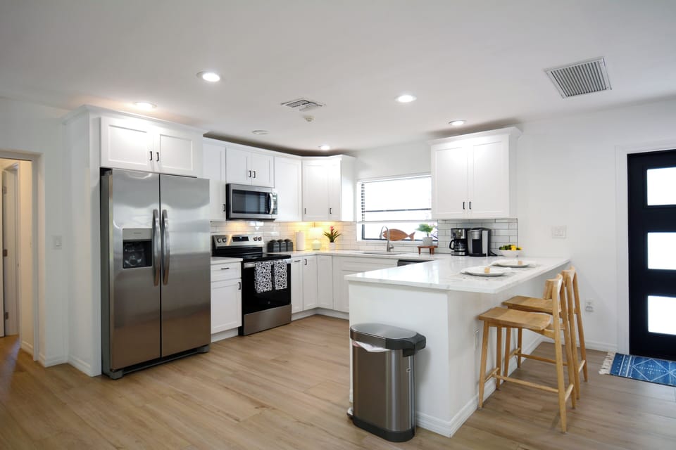 Spacious kitchen with additional seating at the kitchen island breakfast bar