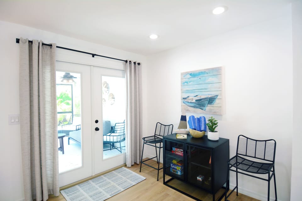 Cabinet with games and sand-resistant Turkish Beach towels and access to pool and seating area