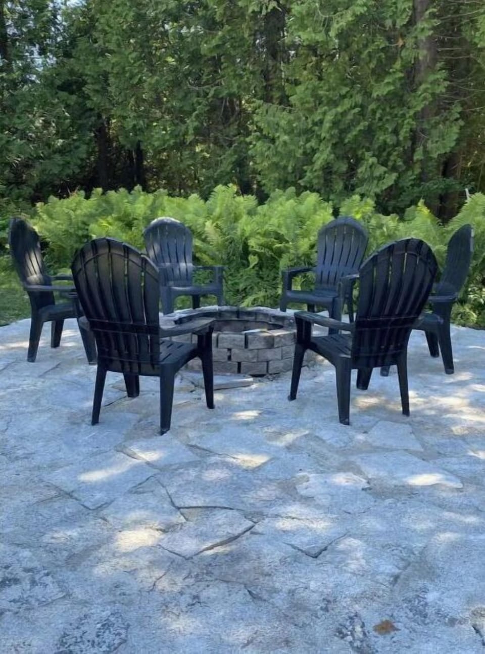 Our large front patio with firepit and seating for 8