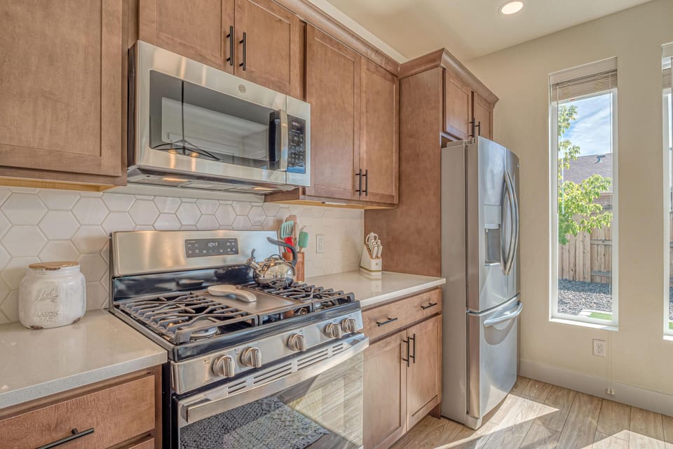 Stylish countertops and top-tier appliances make meal prep a breeze.