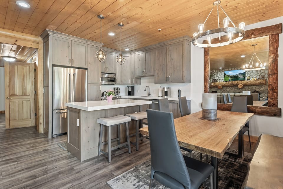 - Open concept kitchen and dining with rustic modern style  
- Wood accents, stone fireplace and stainless steel design  
- Great space for cooking, dining and connecting together
