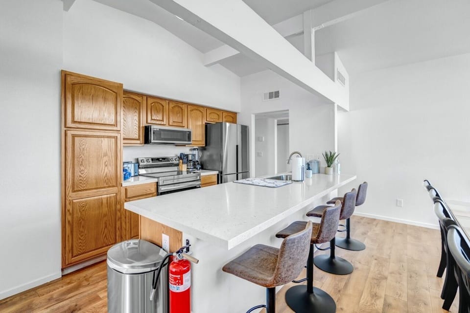 Kitchen with glass walls for visual splendor, high ceilings & entertainment