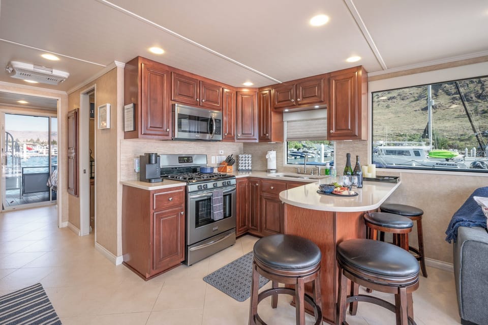 Well-equipped kitchen with stainless appliances; Keurig coffee maker with K-cups provided.