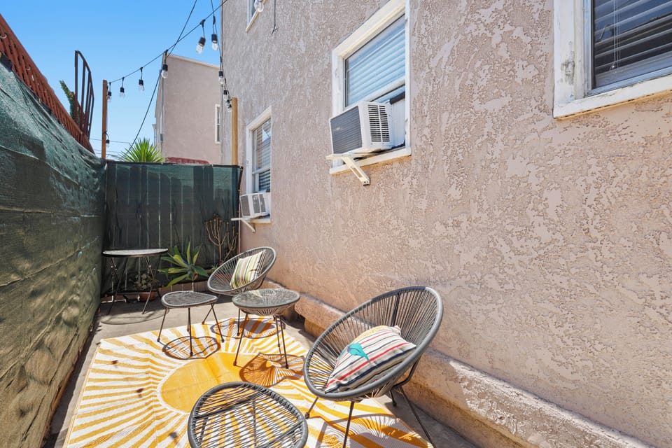 Private Patio with Outdoor Furniture and String Lights