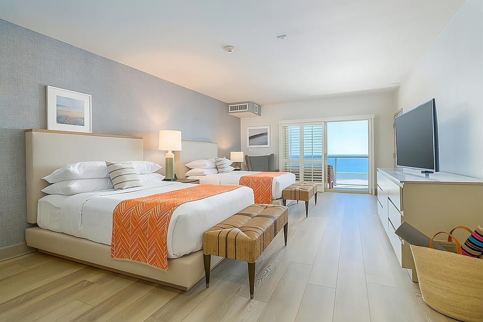 Wake up to ocean breezes from plush beds and balcony views.