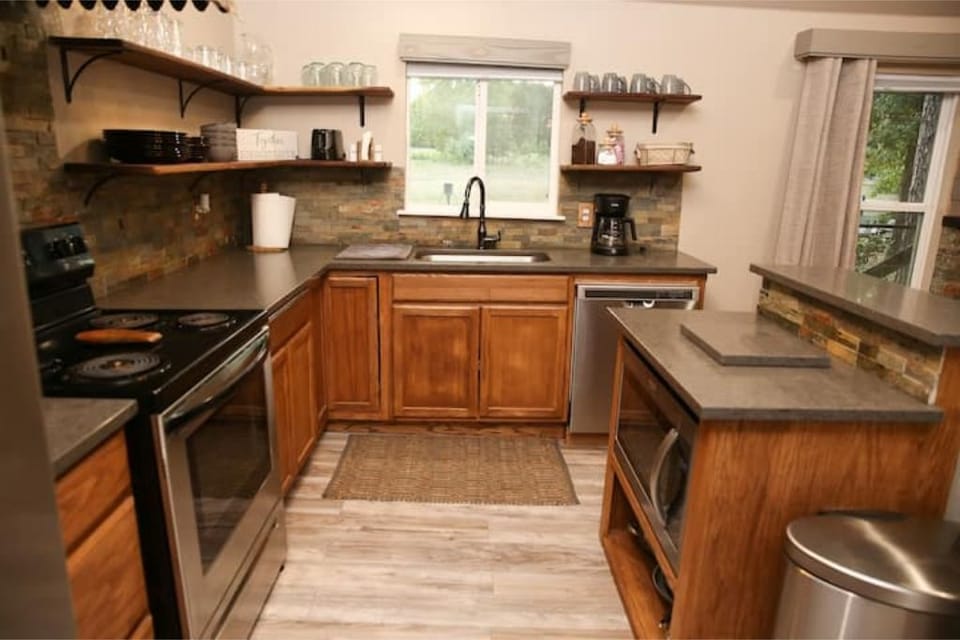 There's a full kitchen with full-sized appliances, coffee maker & toaster.