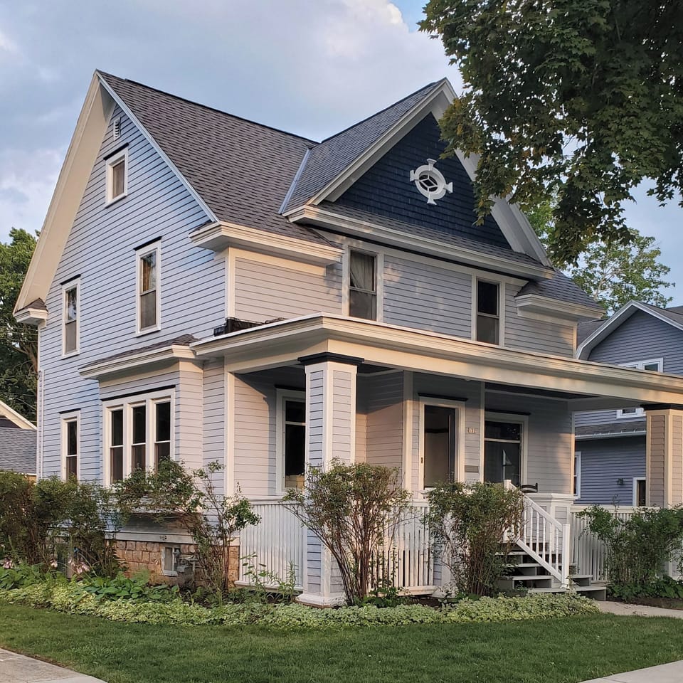 Come home each day to a beautifully restored 1910s Colonial, one of the prettiest houses on the block