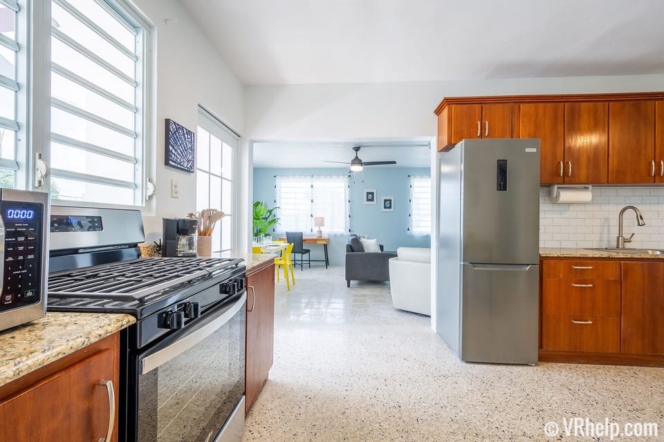 Fully stocked kitchen w/ gas range, microwave, coffee maker, toaster, blender.