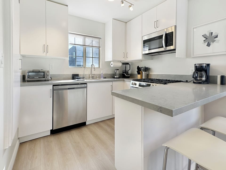 Lots of natural light in this well laid out and fully stocked and newly remodeled kitchen