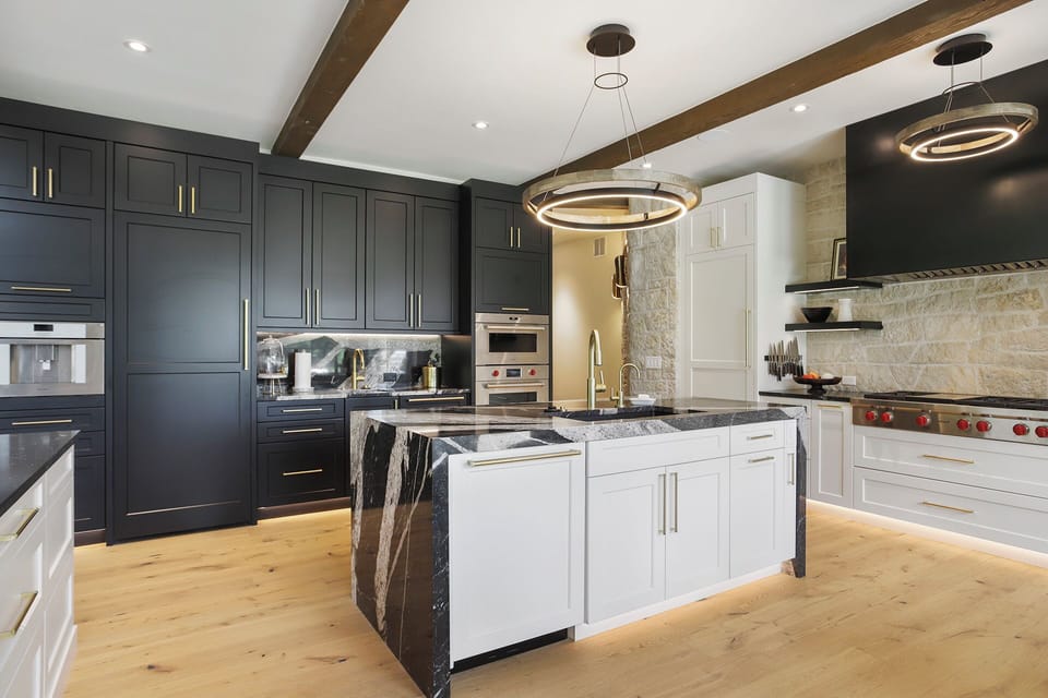 Gourmet kitchen with built-in coffee maker and high-end appliances
