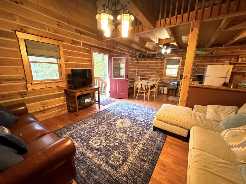 Living room has a large digital TV.