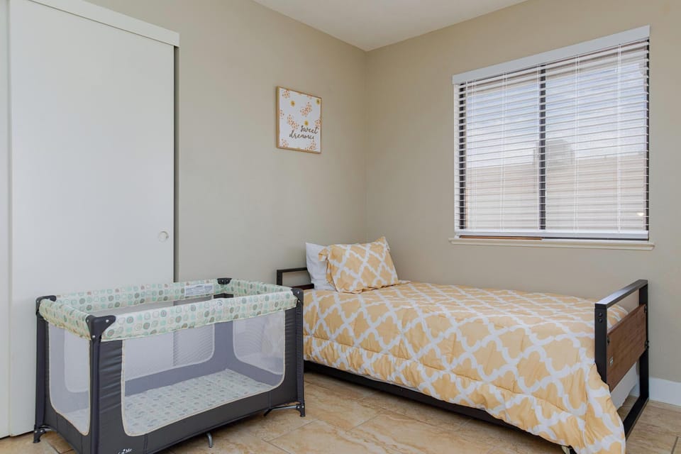 One twin bed pulls out from under the main one.