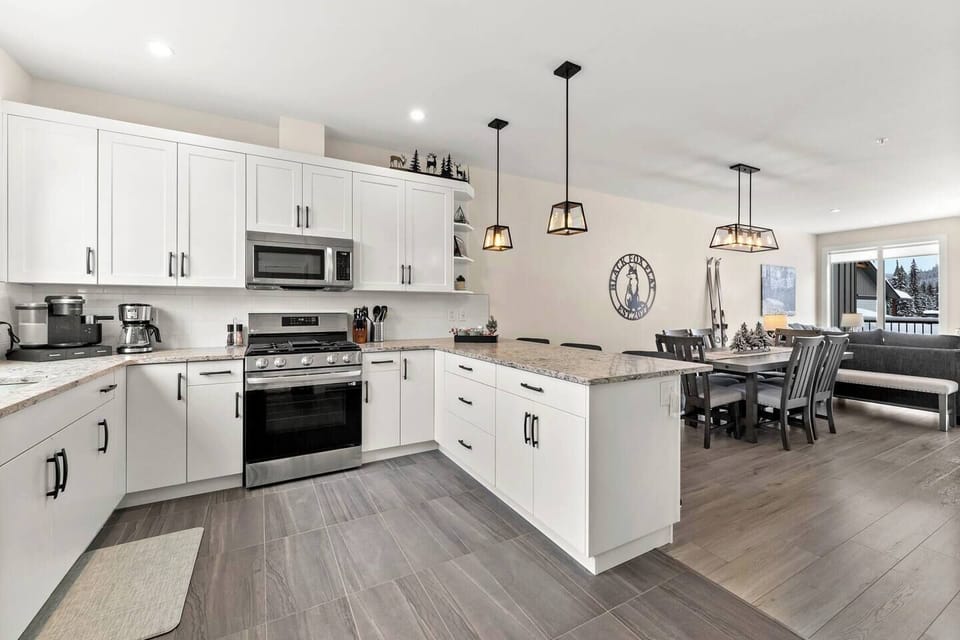 The well equipped kitchen has all new LG appliances with a gas range & air fryer feature oven. The fridge has filtered water & an ice maker. The in floor heating will keep you toasty when you wake up for your first morning coffee. 