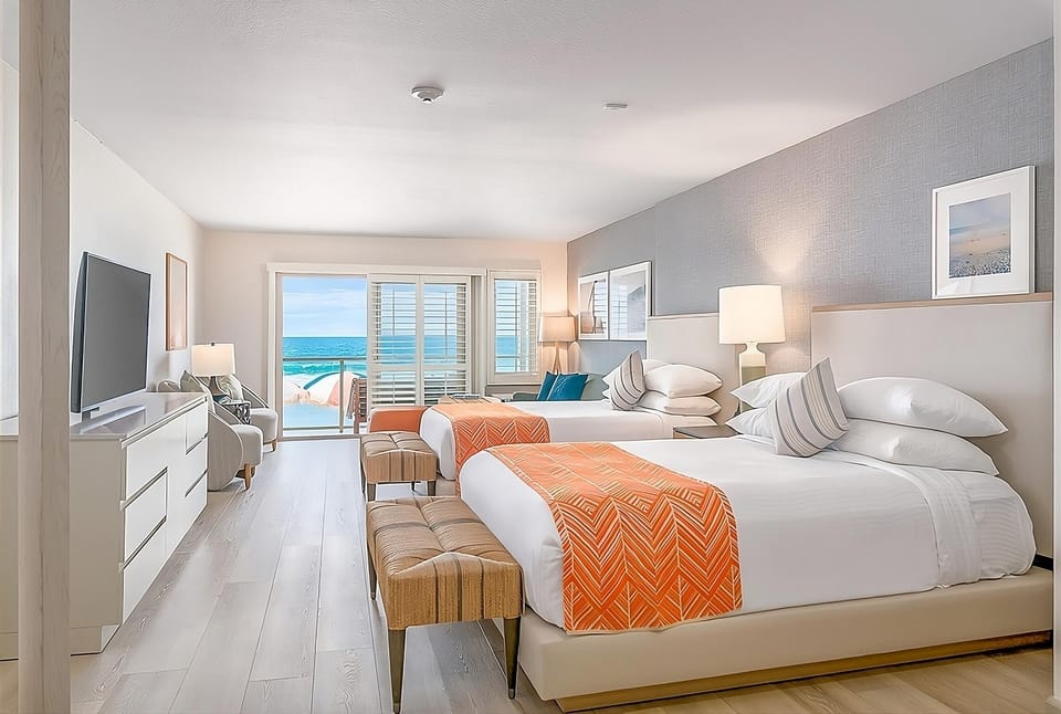 Soak in calming sea views from bed to balcony.