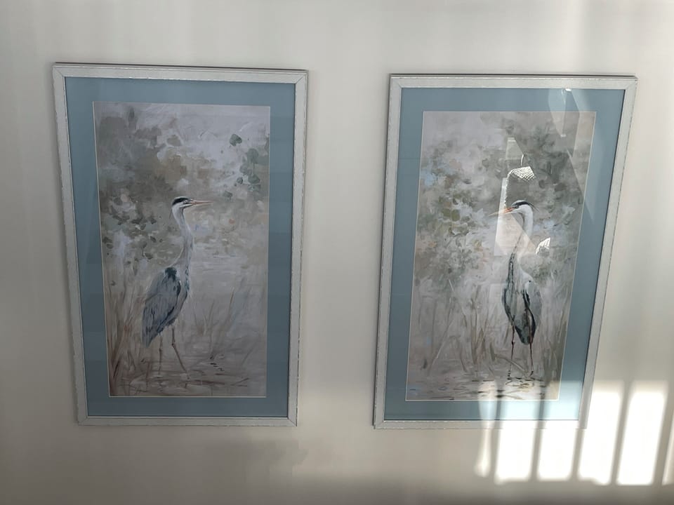 Art throughout home with tasteful, comfortable furniture