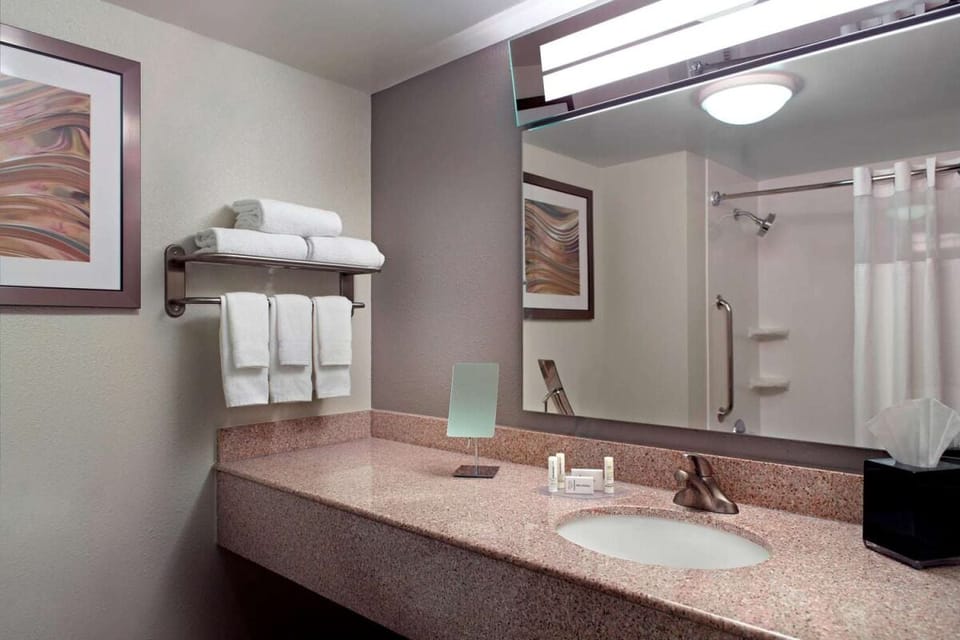 Refresh easily with spacious vanity and bright, clean lighting.