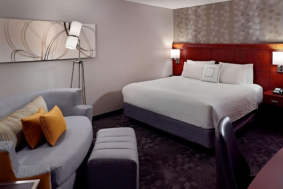 Unwind in a crisp king bed after busy days.