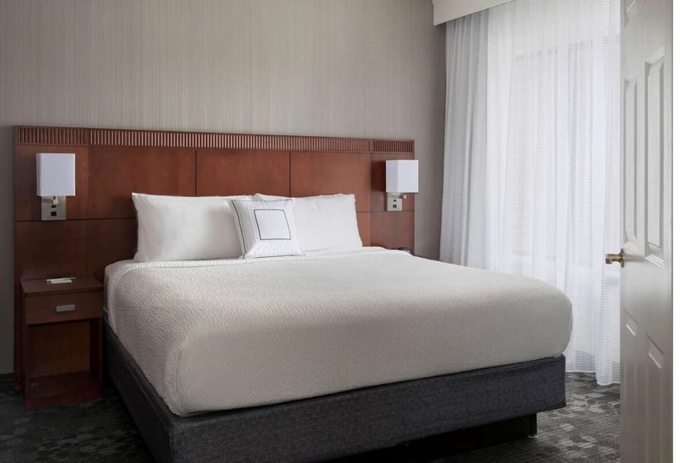 Drift off in a serene king room with hotel-soft bedding.