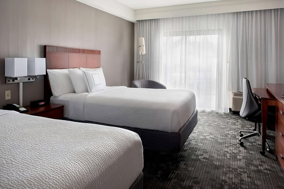 Sink into a dreamy bed with gentle daylight and quiet comfort.