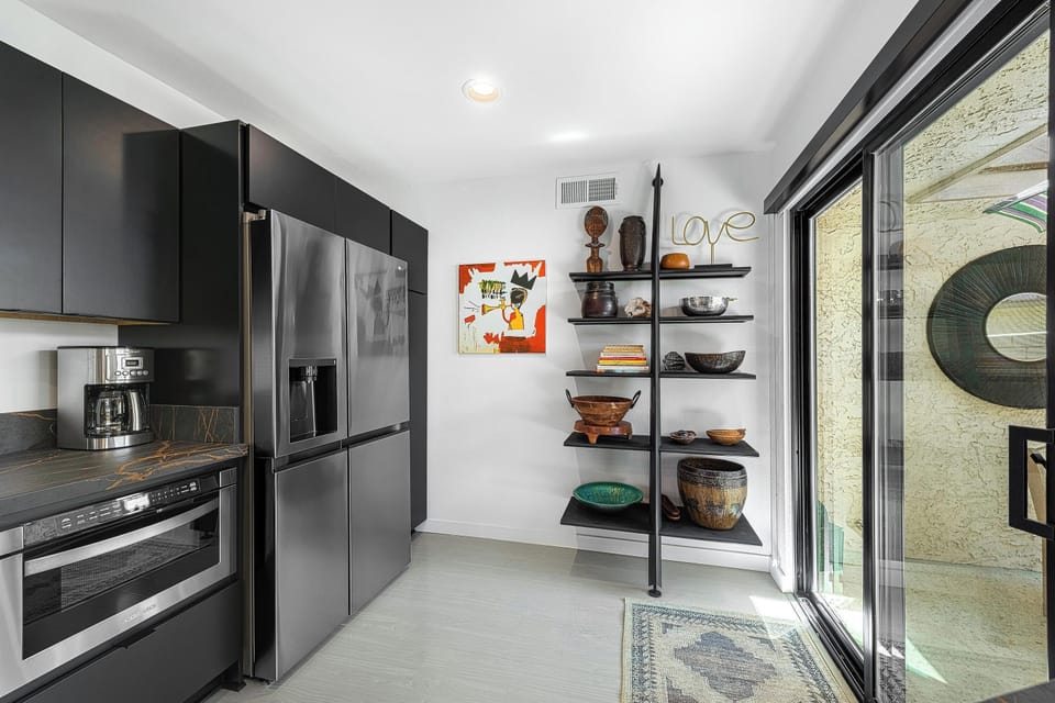 Step into a chef’s paradise in this modern kitchen, where functionality meets style. Equipped with stainless steel appliances, sleek countertops, and ample cabinet space, it invites you to cook and gather with friends and family.