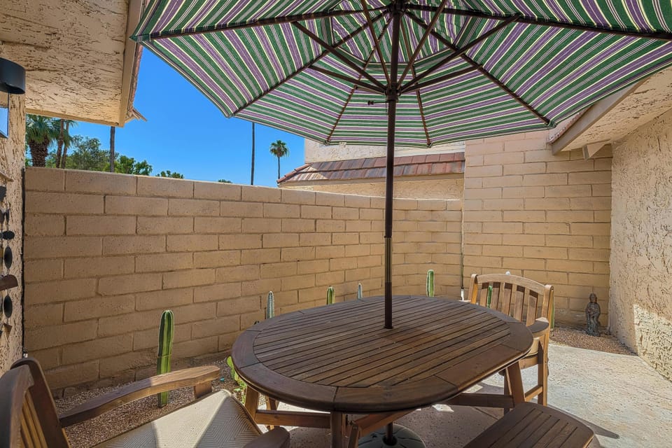 Unwind on the outdoor patio seating.  Enjoy the perfect blend of shade and sunshine while sipping your favorite drink. This serene spot is ideal for relaxation, conversation, or soaking up the view. Your private oasis awaits!