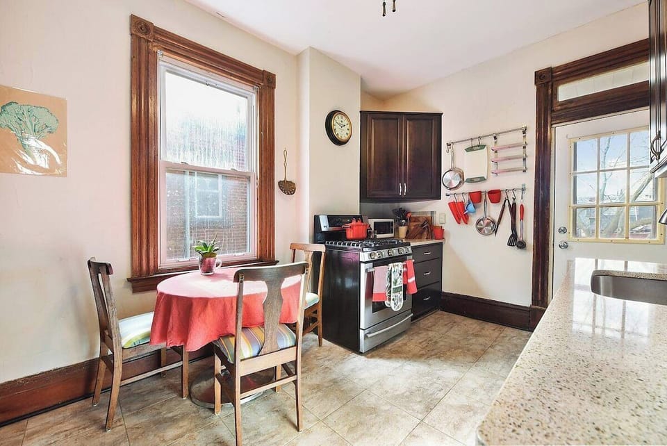 Reliable and well maintained kitchen with table for three.